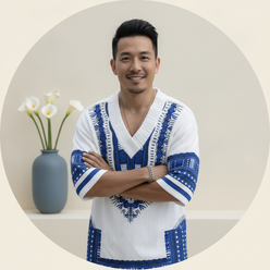 Portrait of David Chen, a smiling Asian man, wearing the EXARUS two-piece summer set, against a light cream background.