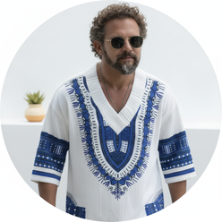 Circular portrait of a smiling man, Chris Miller, wearing the EXARUS patterned V-neck top against a clean white background.